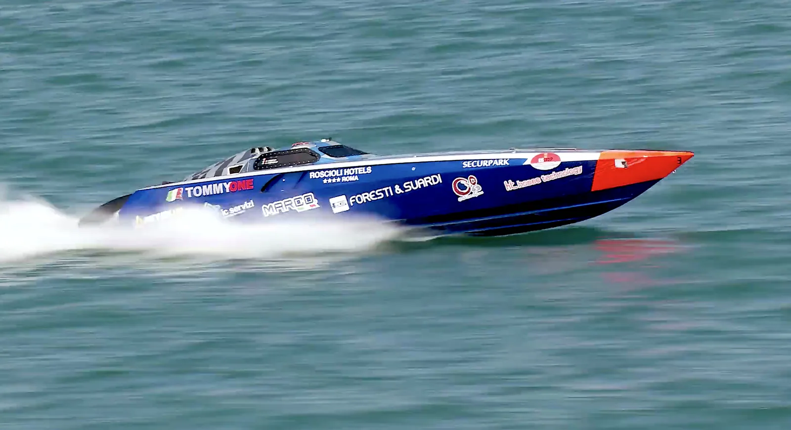 Tommy One racing at speed during its Italian world-record programme