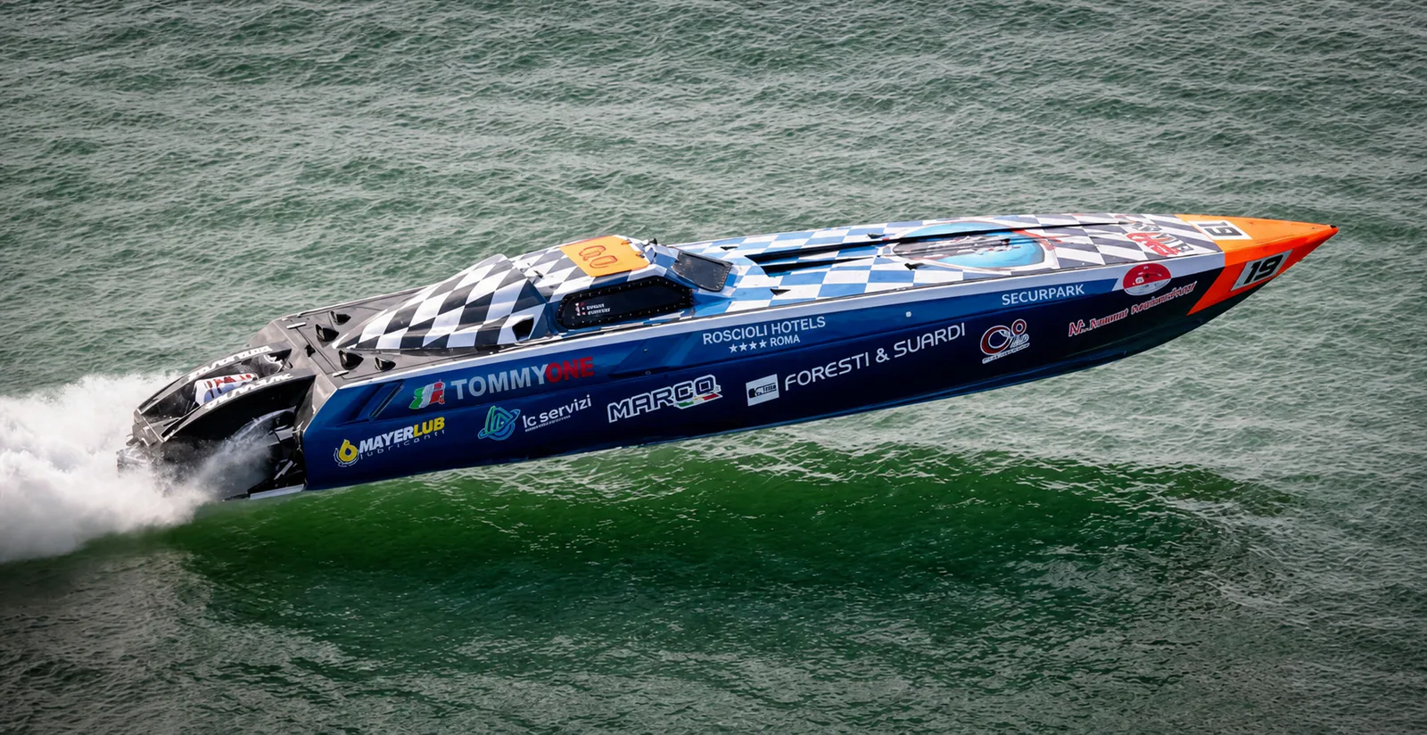 Tommy One airborne above open water