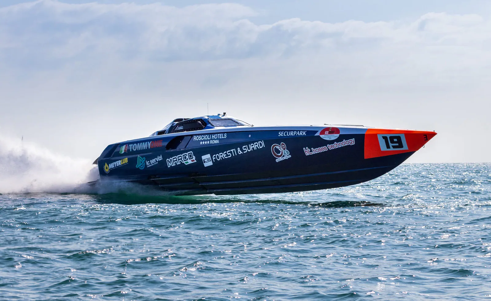 Tommy One racing at high speed in side profile