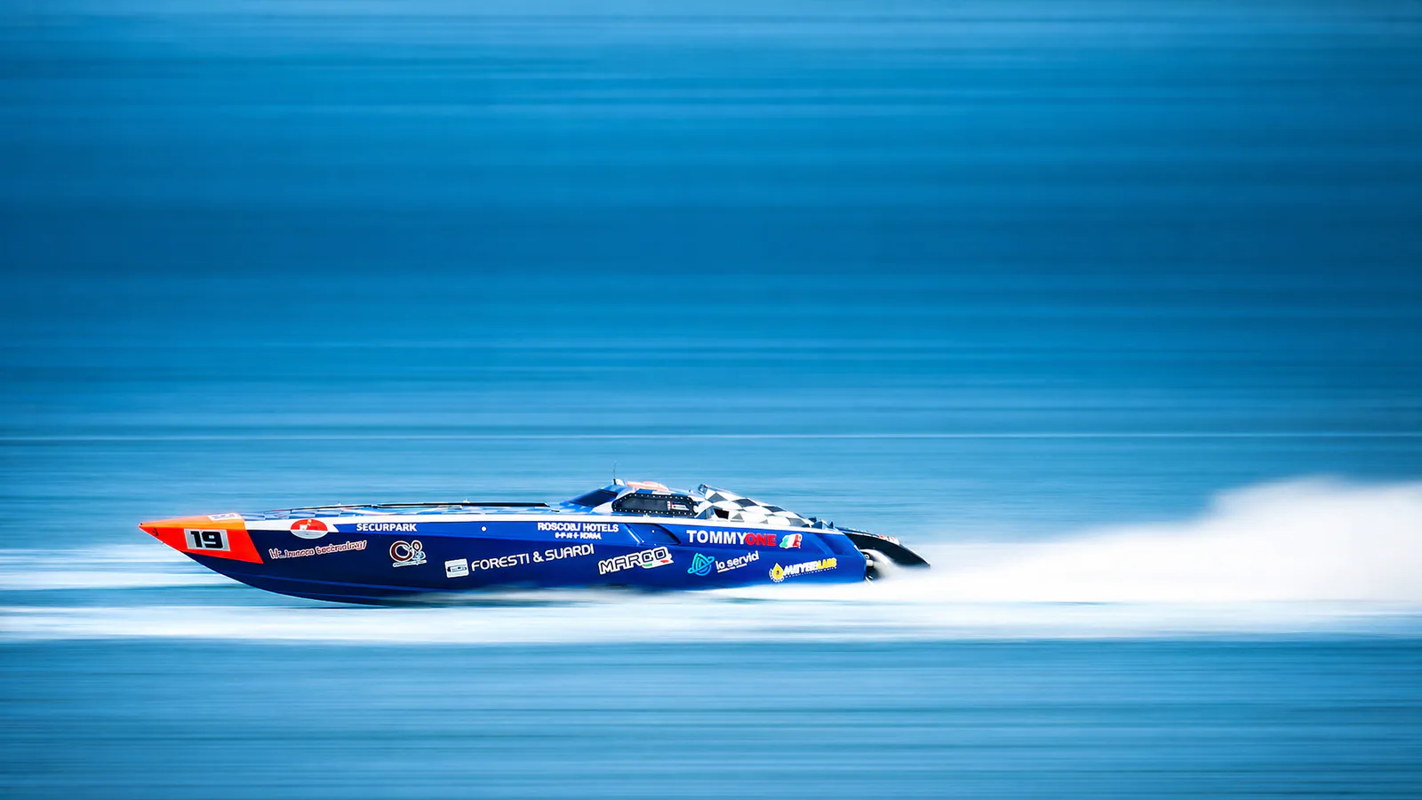 Tommy One isolated at speed against motion-blurred water