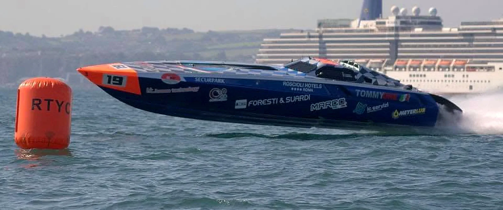 Tommy One racing close to an offshore course buoy